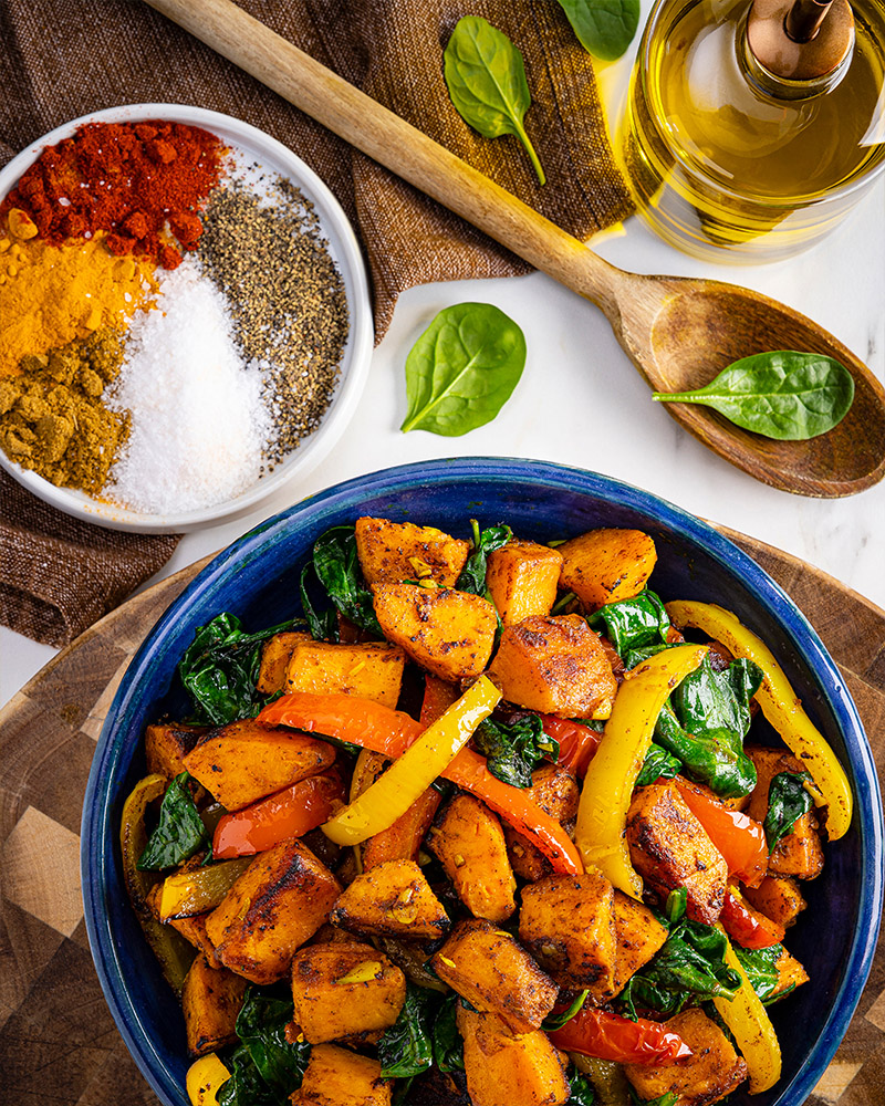 Turmeric-Spiced Sweet Potatoes with Spinach & Peppers